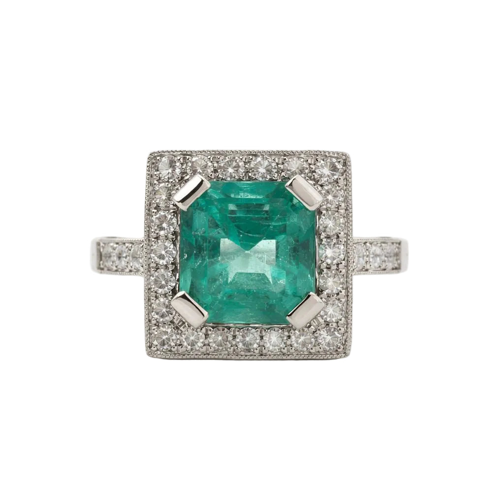 ANILLO DE ORO BLANCO CON ESMERALDA CENTRAL TALLA RECTANGULAR Y DIAMANTES NATURALES - Castafiore