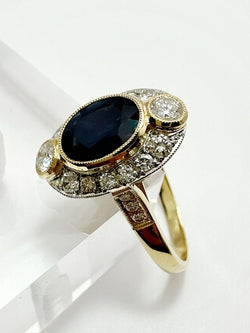 ANILLO DE ZAFIRO AZUL Y DIAMANTES EN ORO AMARILLO CON VISTAS EN PLATINO - Castafiore