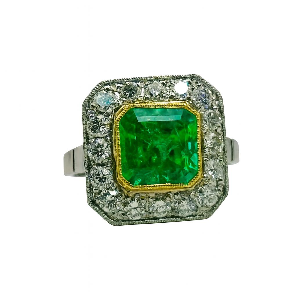 ANILLO DISEÑO VINTAGE EN PLATINO CON ESMERALDA CENTRAL Y HALO DE DIAMANTES - Castafiore