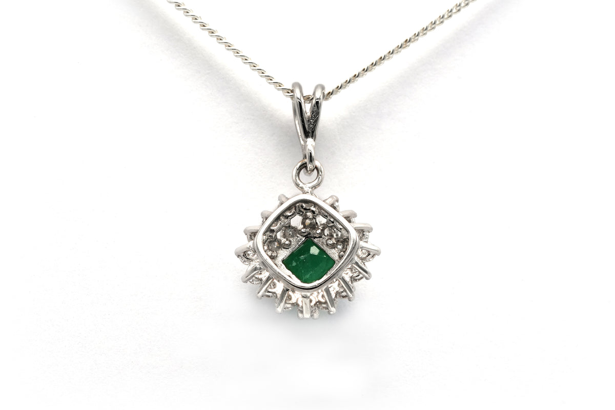 White gold pendant with emeralds and diamonds