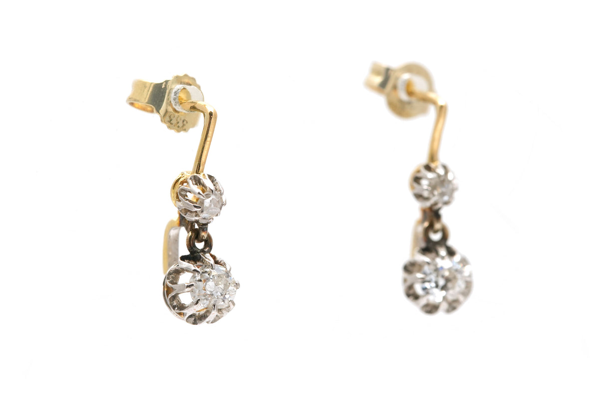 Earrings in yellow gold, silver, and diamonds