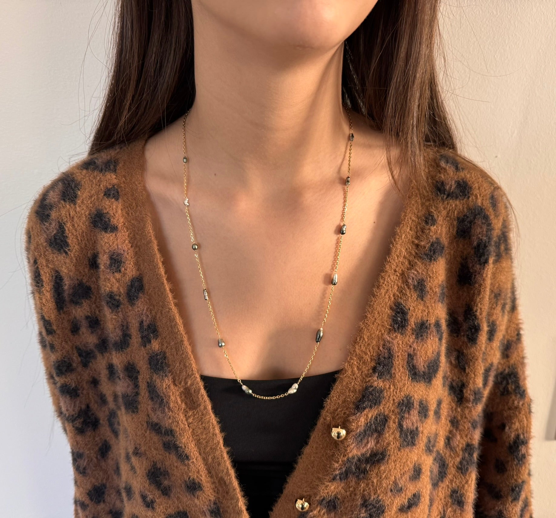 Rose gold long necklace with Tahitian pearls.