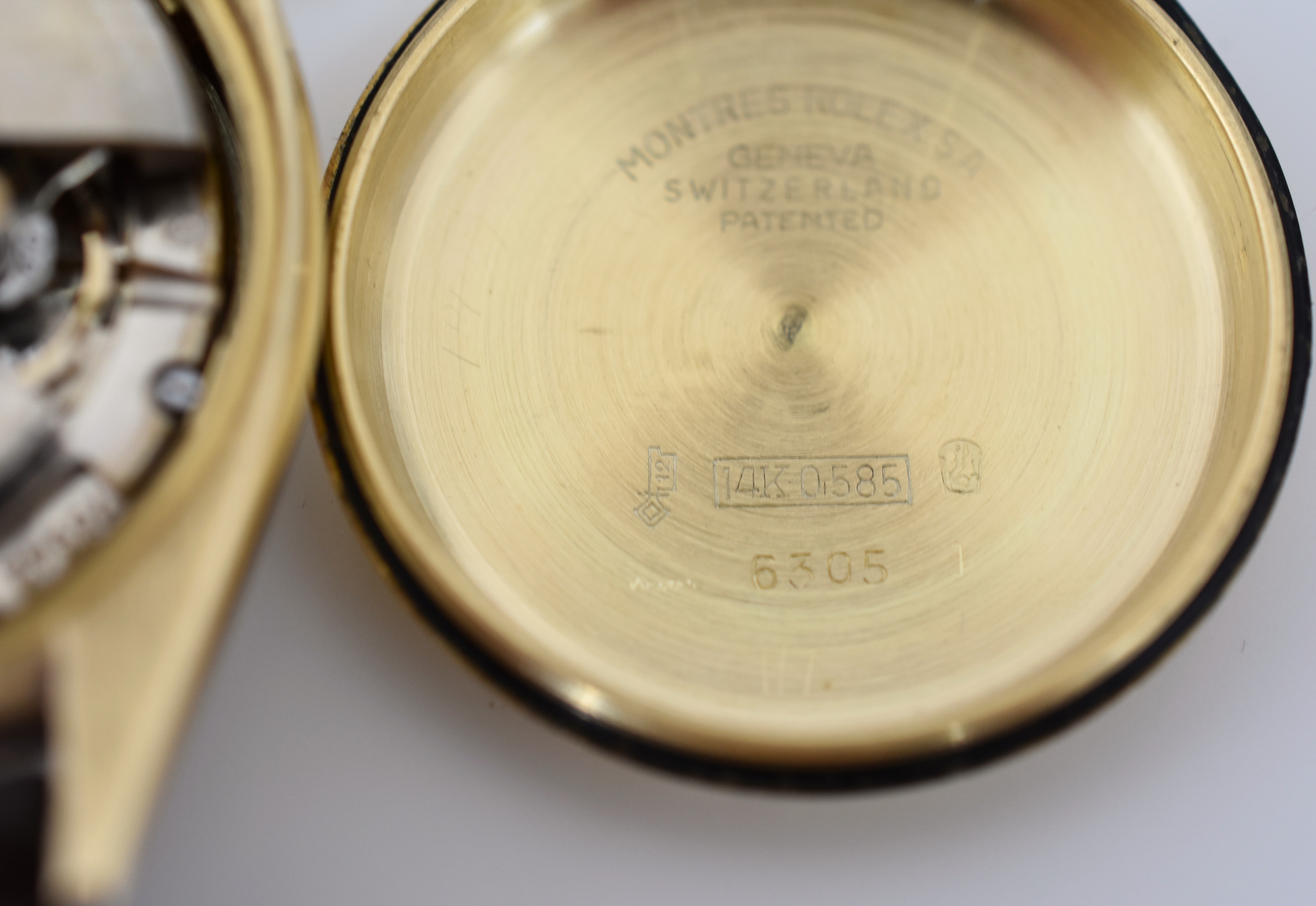 ROLEX "Oyster Perpetual Date Ovettone" watch in yellow gold and leather