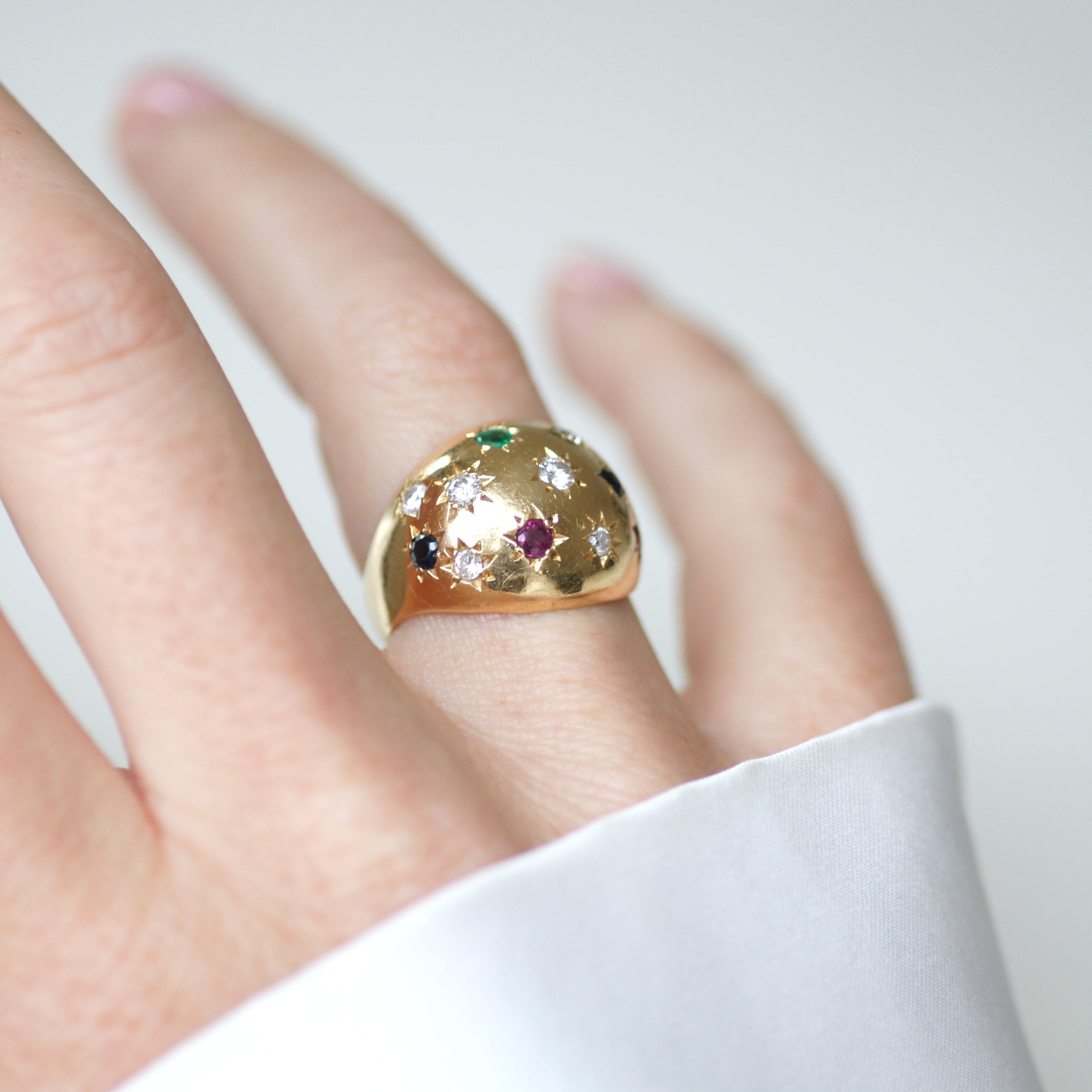 Ring in yellow gold, sapphires, emeralds, rubies, and diamonds