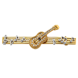 Brooch in yellow gold, white gold, and diamonds