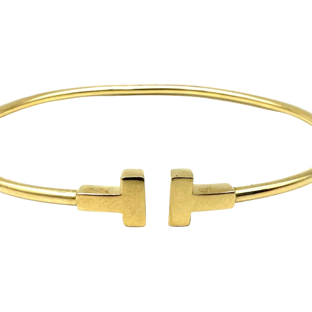 TIFFANY & CO. "Tiffany T" Yellow Gold Bangle