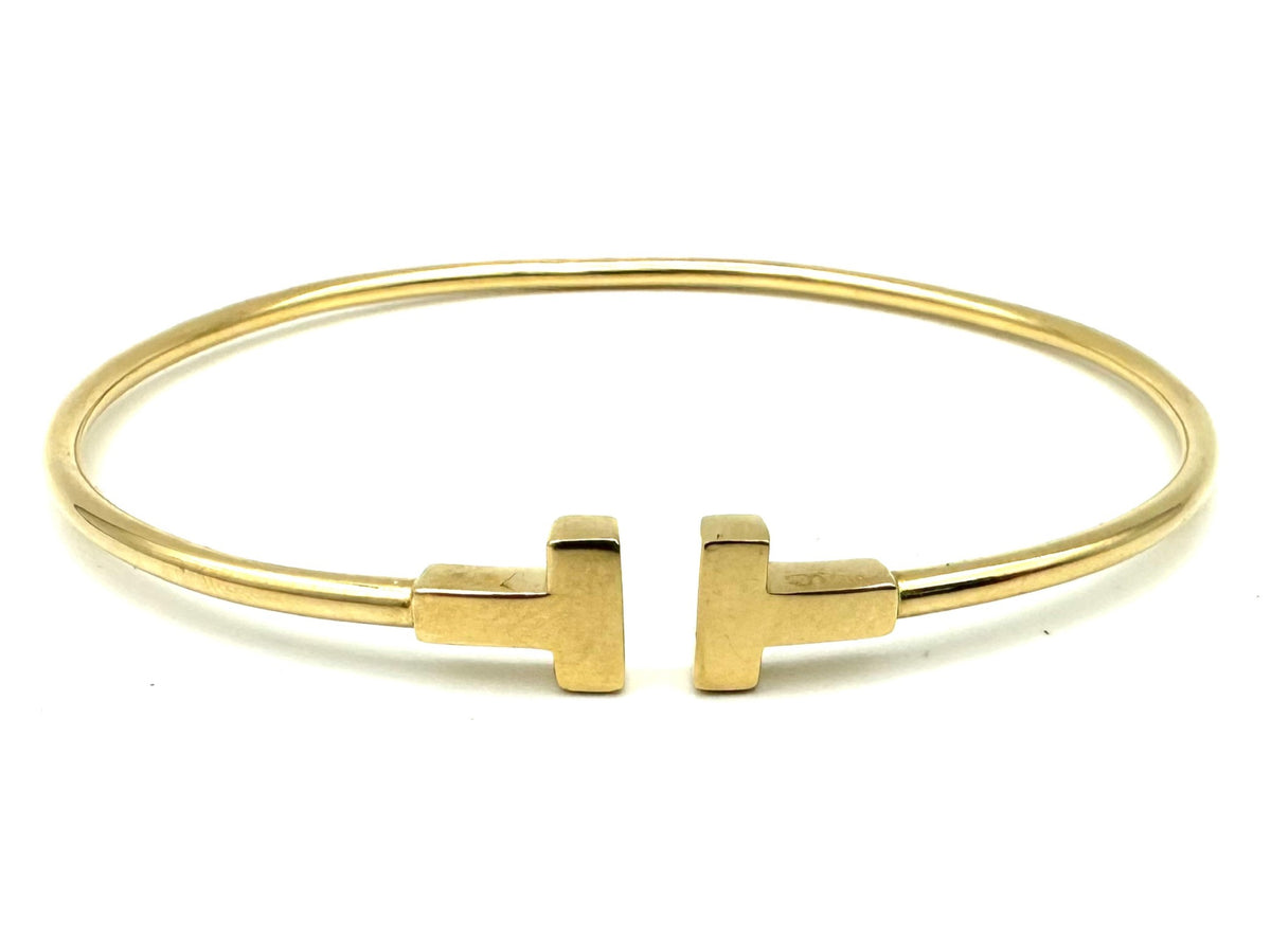 TIFFANY & CO. "Tiffany T" Yellow Gold Bangle Bracelet