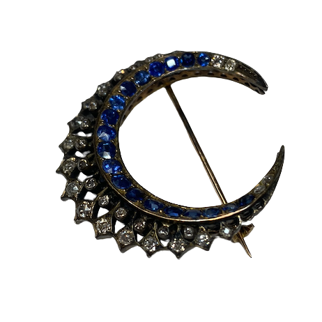 Brooch made of yellow gold, silver, sapphires, and diamonds