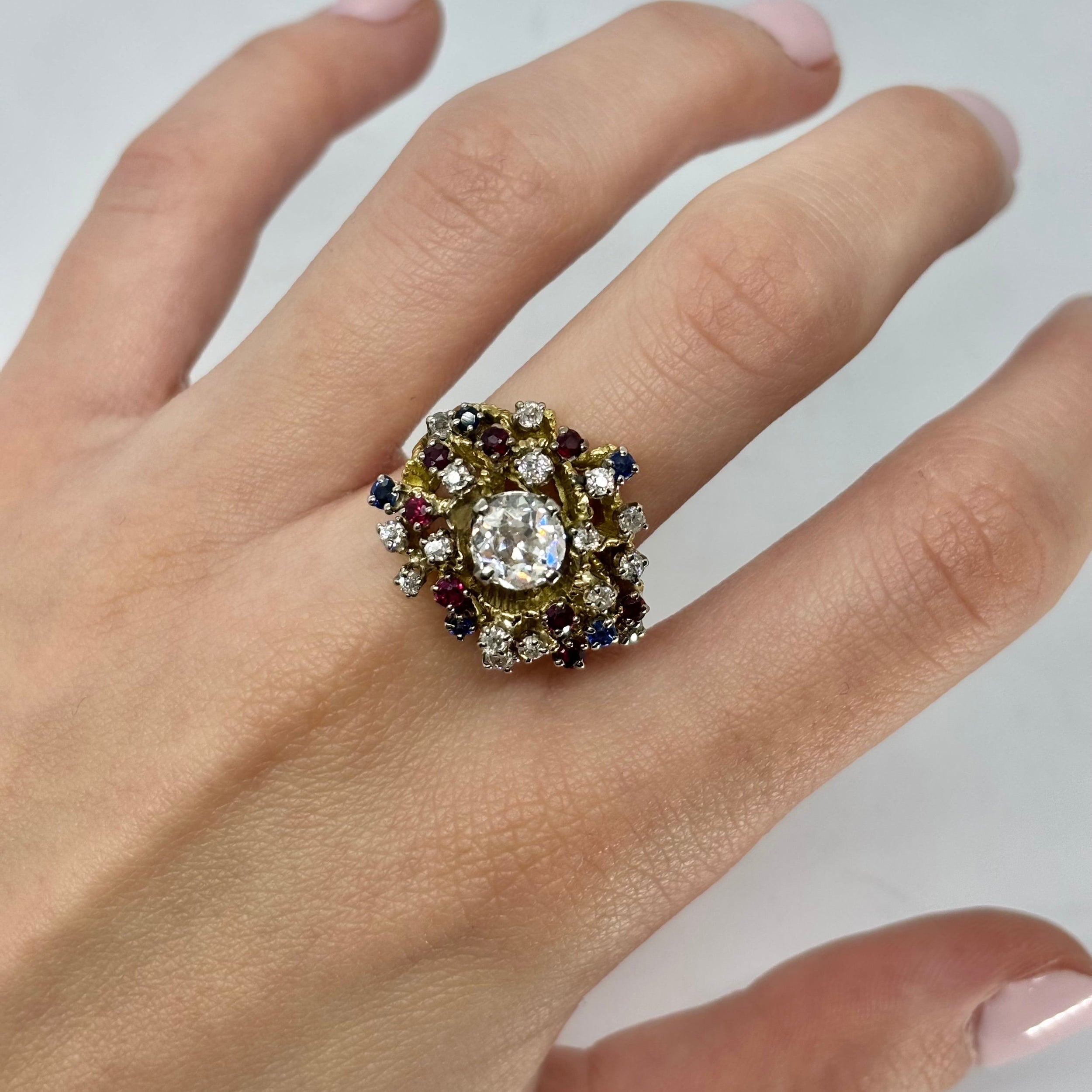 Antique yellow gold ring with rubies, sapphires, and diamonds