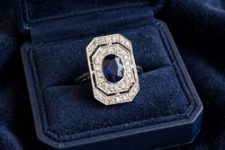 "Entourage" Ring in White Gold, Sapphire, and Diamonds