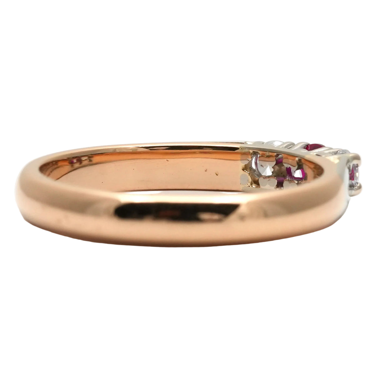 Trilogy Ring in white gold, yellow gold, rubies, and diamonds