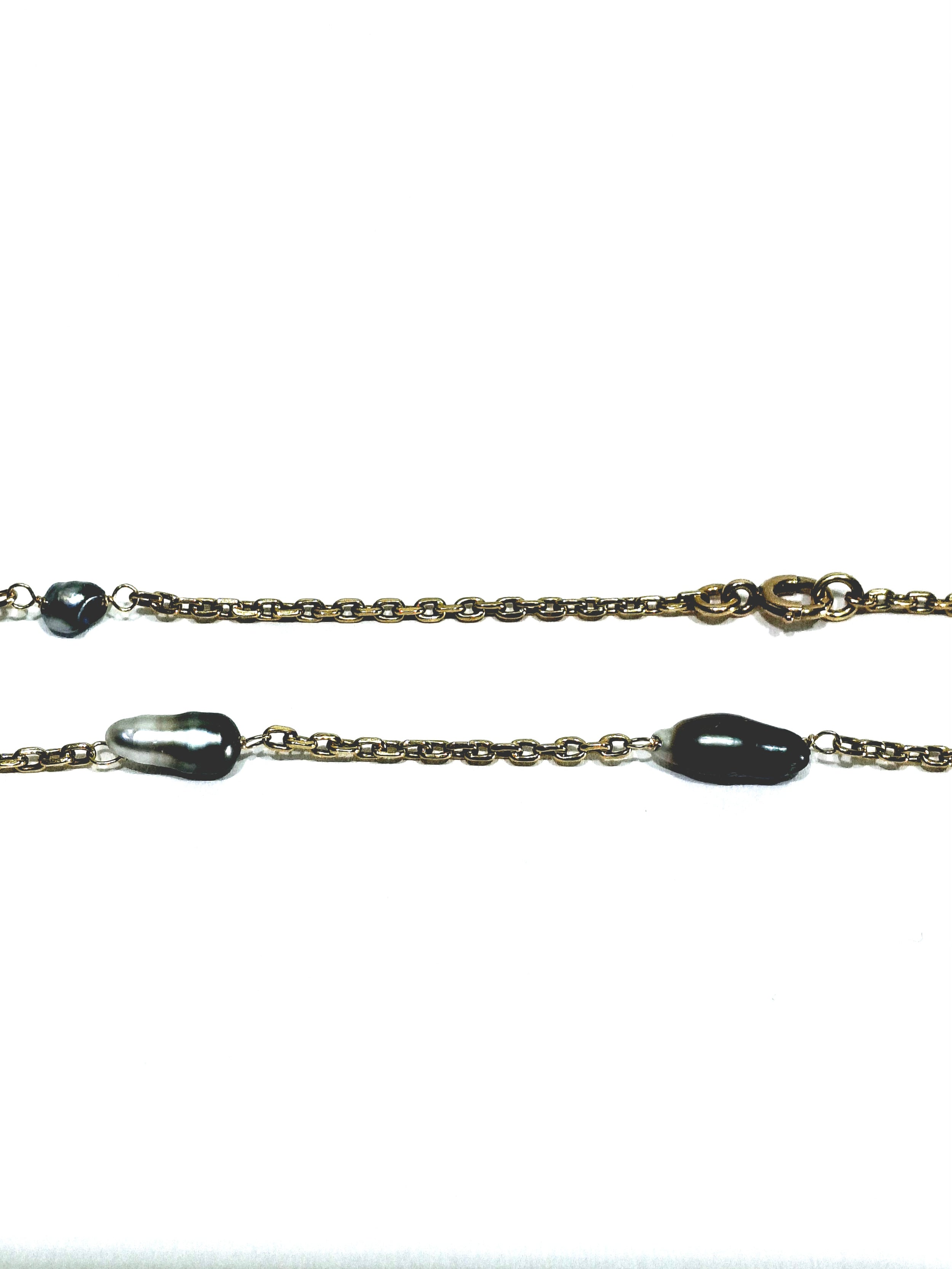 Rose gold long necklace with Tahitian pearls.