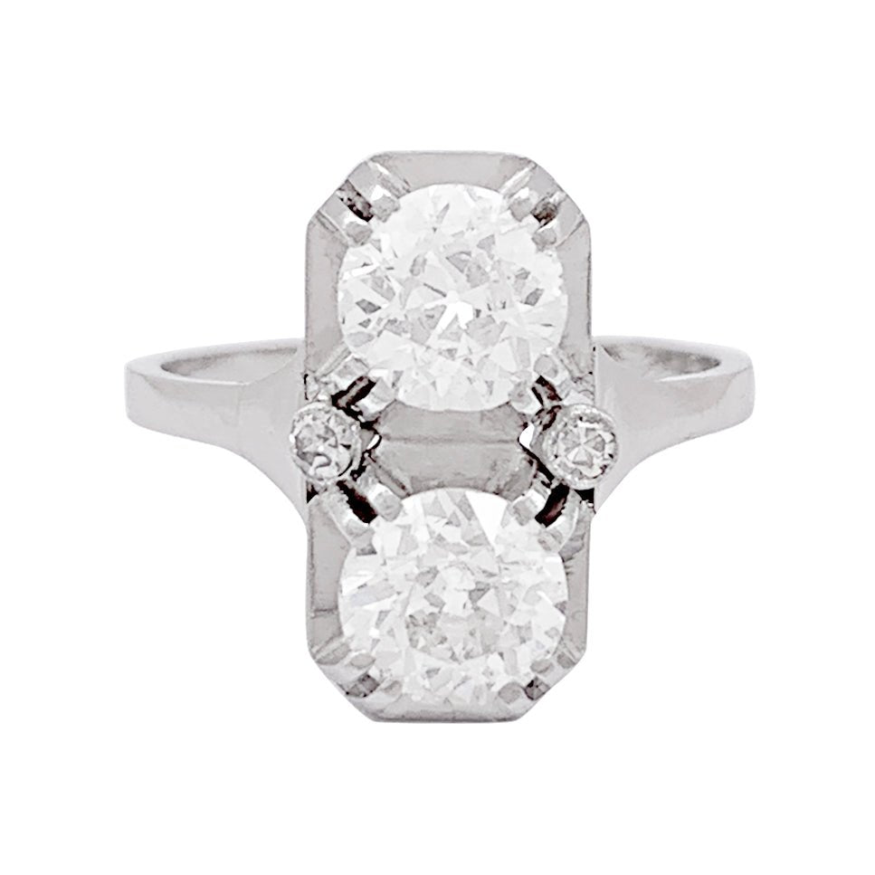 Bague ancienne "Toi & Moi", platine, diamants. - Castafiore