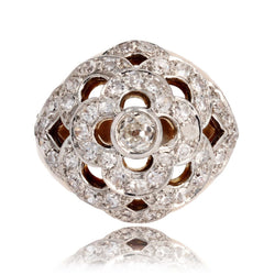 Bague boule ajourée d'un décor de fleur et diamants - Castafiore