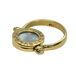 Bague BULGARI "Réversible" en or jaune, nacre et onyx - Castafiore