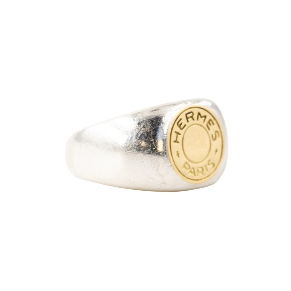 Bague Chevalière HERMÈS "Clou de selle" en argent et or jaune - Castafiore