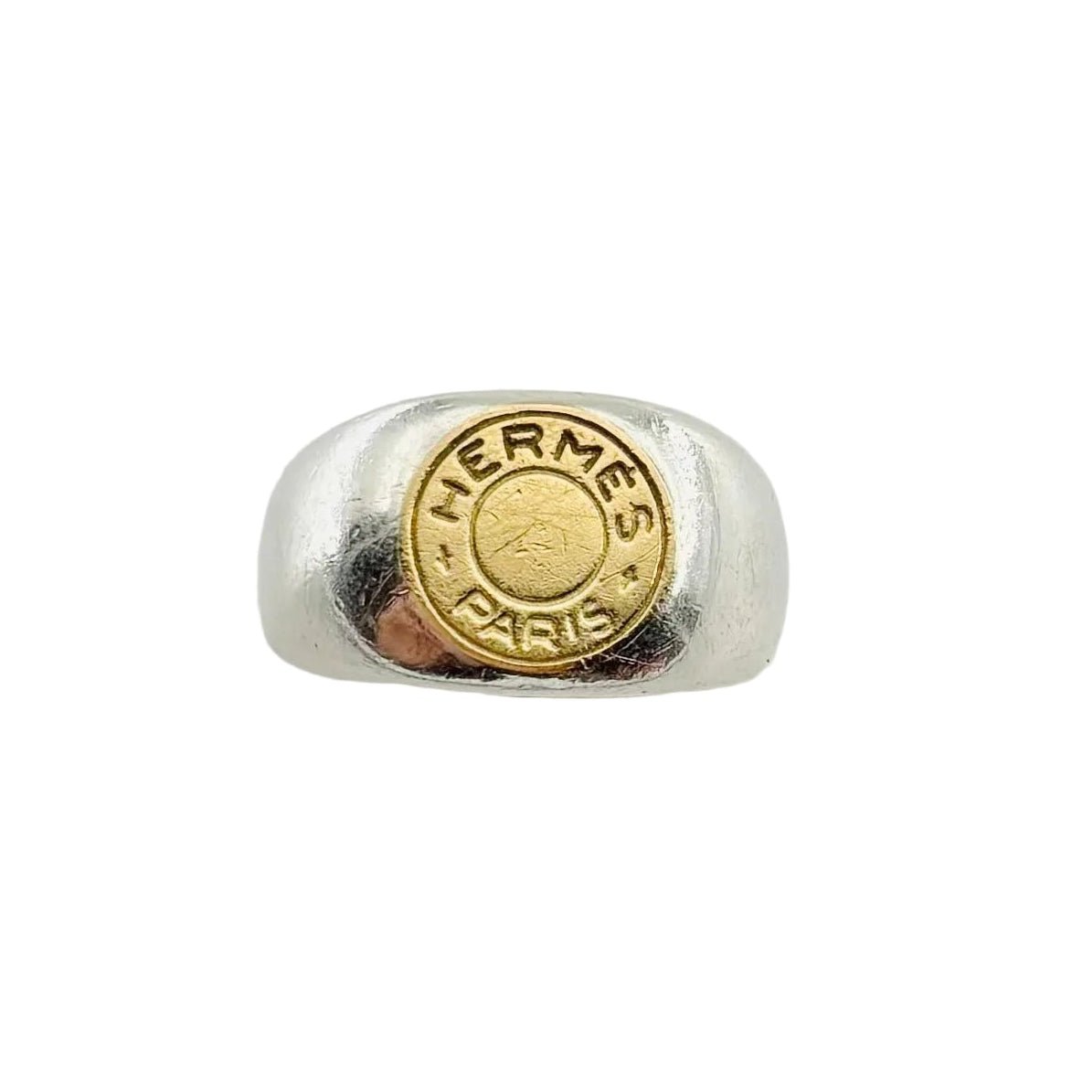 Bague Chevalière HERMÈS "Clou de selle" en argent et or jaune - Castafiore