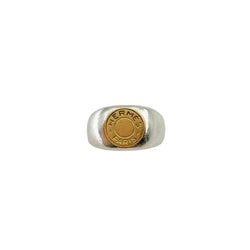Bague Chevalière HERMÈS "Clou de selle" en argent et or jaune - Castafiore
