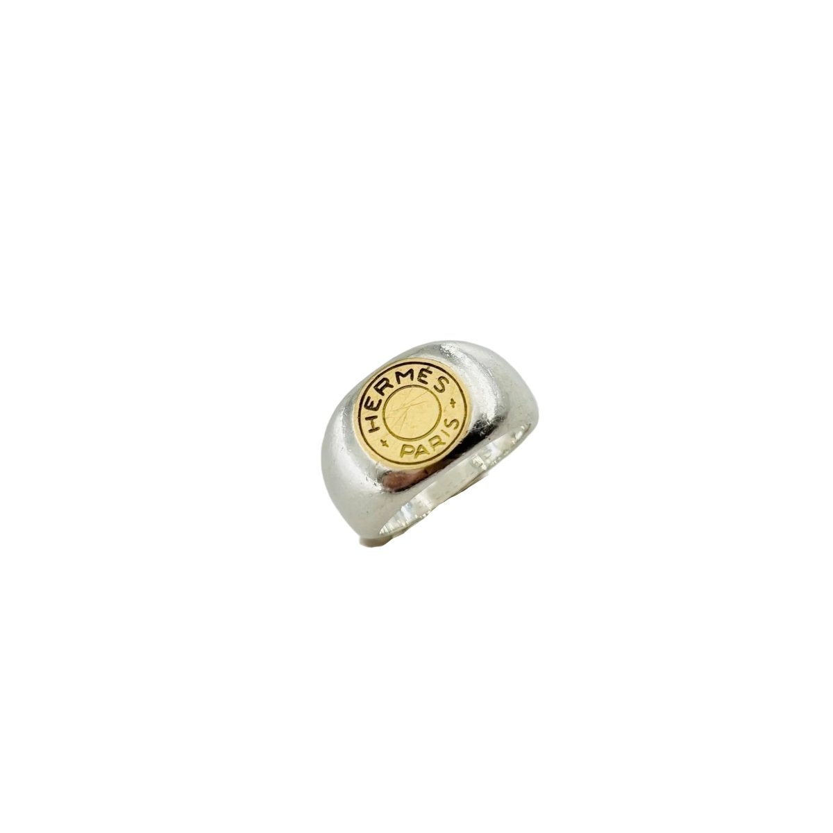 Bague Chevalière HERMÈS "Clou de selle" en argent et or jaune - Castafiore