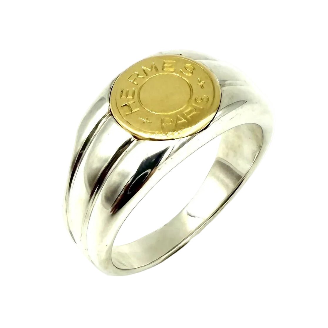 Bague Chevalière HERMÈS "Clou de selle" en or jaune et argent - Castafiore