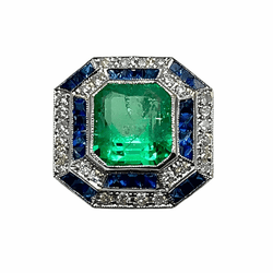 Bague Cocktail en or blanc, émeraude, saphirs et diamants - Castafiore