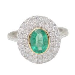 Bague double entourage en or bicolore, émeraude ovale et diamants - Castafiore