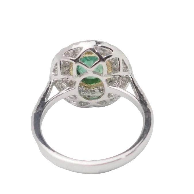 Bague double entourage en or bicolore, émeraude ovale et diamants - Castafiore