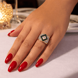 Bague en or blanc, or jaune, saphirs, émeraudes et diamants - Castafiore