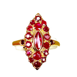 Bague en or jaune 18 carats pavée de rubis. - Castafiore