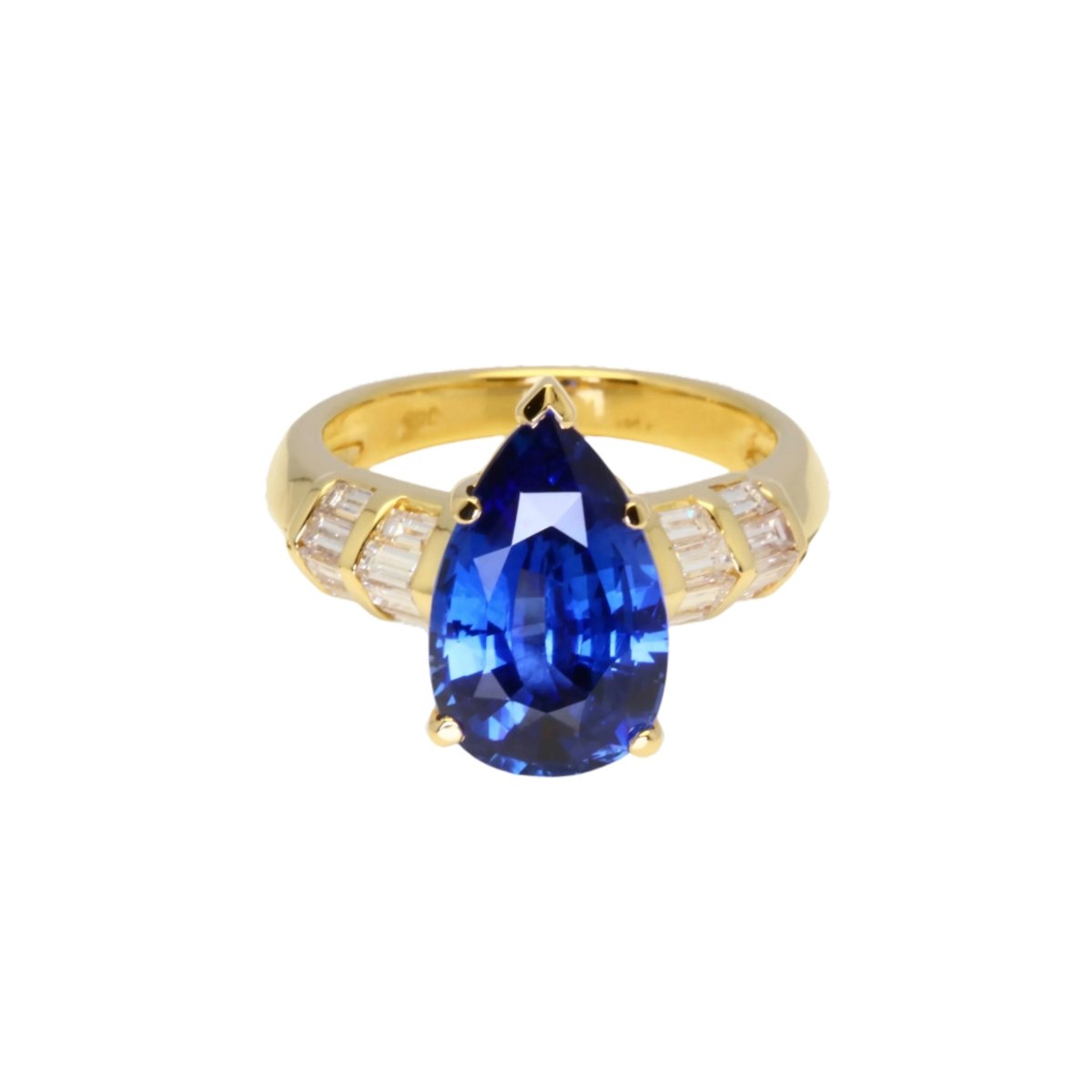Bague en or jaune ornée d’un saphir bleu Ceylan et de diamants. - Castafiore