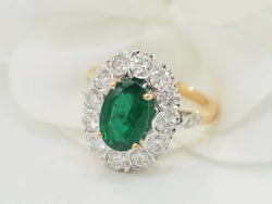 Bague entourage en or bicolore, émeraude et diamants - Castafiore