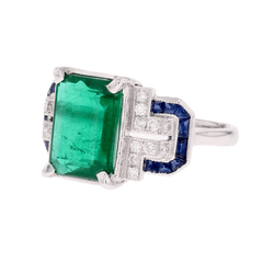 Bague Entourage en or blanc, émeraude, saphirs et diamants - Castafiore