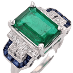 Bague Entourage en or blanc, émeraude, saphirs et diamants - Castafiore