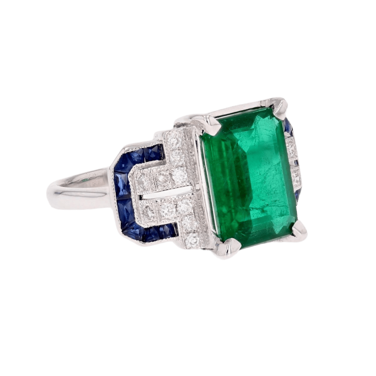 Bague Entourage en or blanc, émeraude, saphirs et diamants - Castafiore