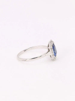 Bague Entourage en or blanc, platine, pierre bleue et diamants - Castafiore