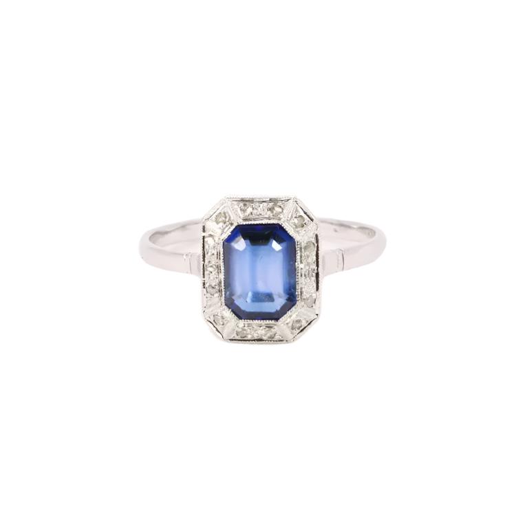 Bague Entourage en or blanc, platine, pierre bleue et diamants - Castafiore