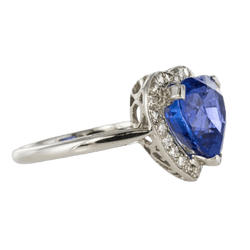 Bague Entourage en or blanc, tanzanite et diamants - Castafiore