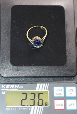 Bague Entourage en or jaune, or blanc, saphir et diamants - Castafiore