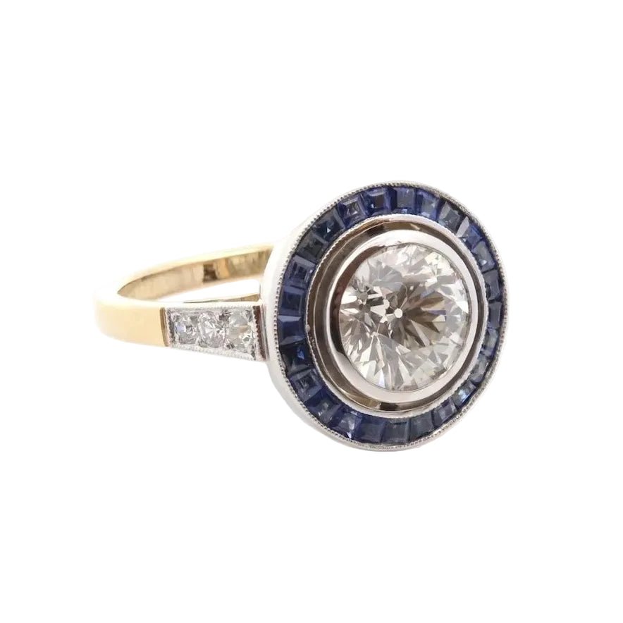 Bague Entourage en or jaune, platine, saphirs et diamants - Castafiore