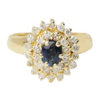 Bague entourage en or jaune, saphir et diamants - Castafiore