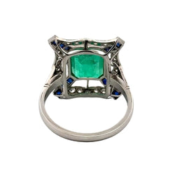 Bague Entourage en platine, émeraude, saphirs et diamants - Castafiore