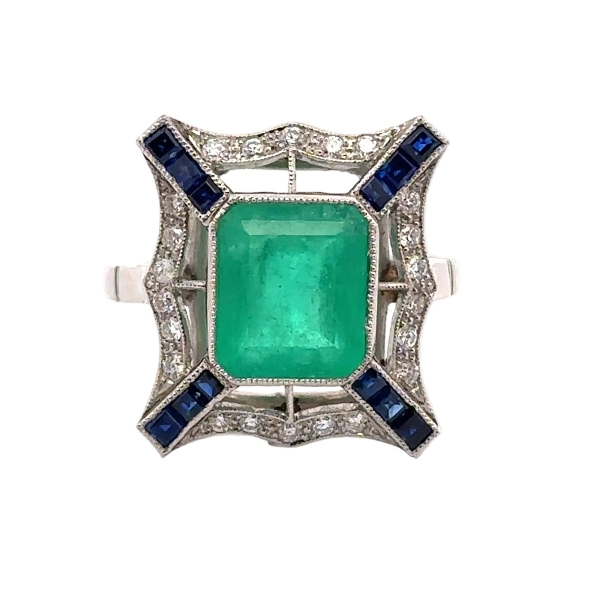 Bague Entourage en platine, émeraude, saphirs et diamants - Castafiore