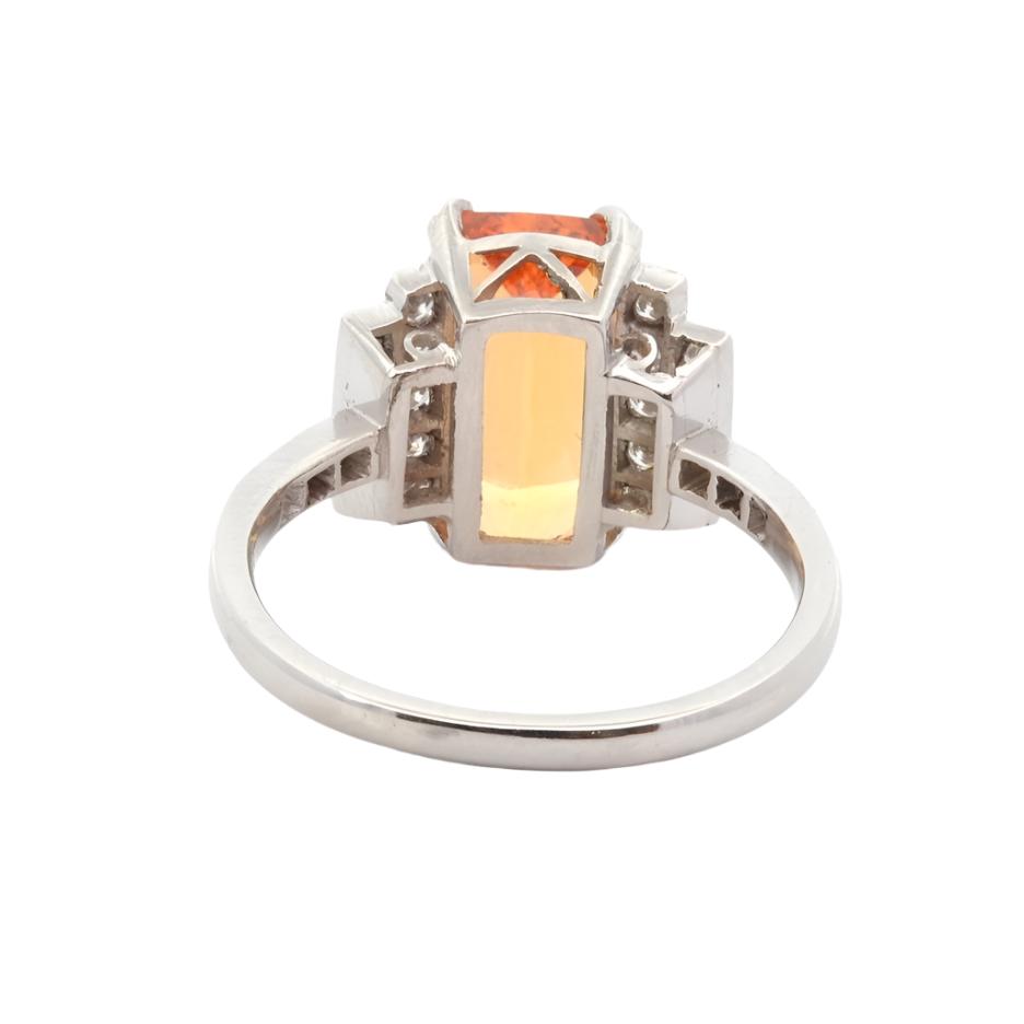 Bague entourage en platine, topaze et diamants - Castafiore