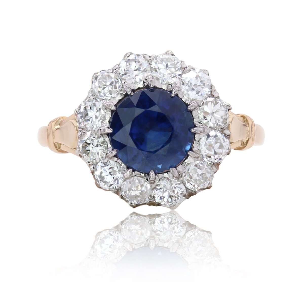 Bague marguerite ancienne en or rose et platine avec saphir et diamants - Castafiore