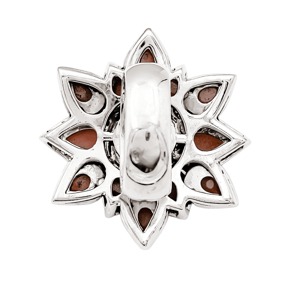 Ring flower, white gold, diamonds and angel-skin coral.
