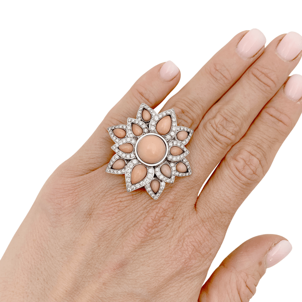 Ring flower, white gold, diamonds and angel-skin coral.