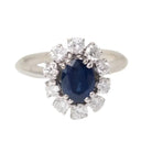 Bague marguerite en or blanc, saphir ovale et diamants - Castafiore