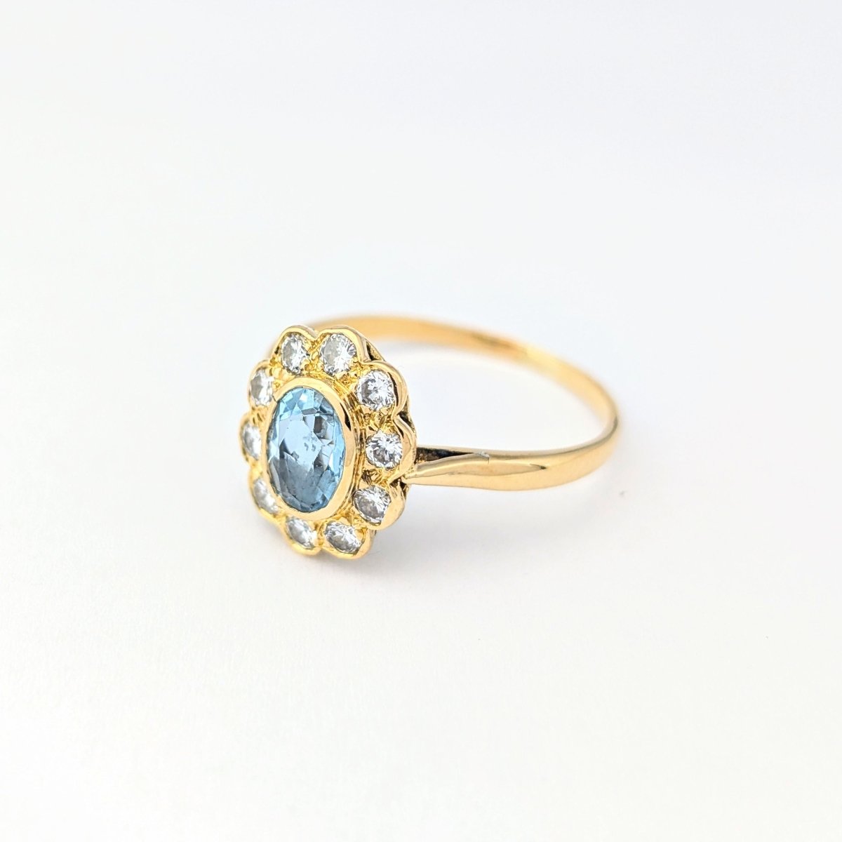 Bague Marguerite en or jaune diamants et aigue - marine - Castafiore