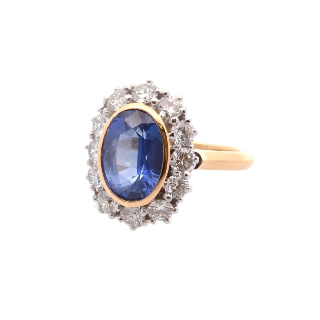 Bague Marguerite en or jaune, platine, saphir, et diamants - Castafiore