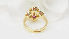 Bague marguerite en or jaune, rubis et diamants - Castafiore